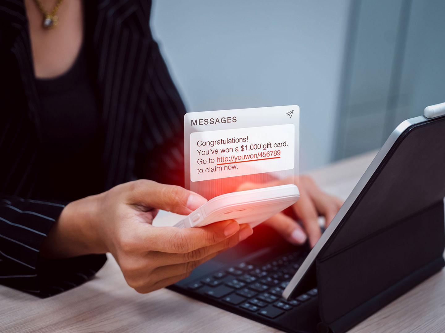 A tablet and smartphone displaying a suspicious SMS notification, could be a scam